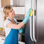 maid cleaning a refigerator